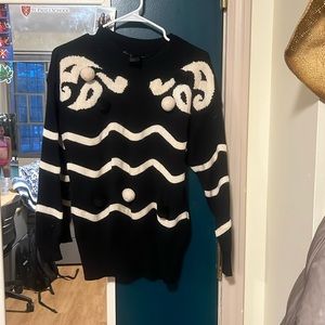 Nice black and white sweater with puffs on it super cute size medium